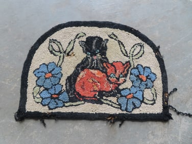 A small welcome form hooked rug decorated with 2 kittens resting within floral wreath, circa 1950.