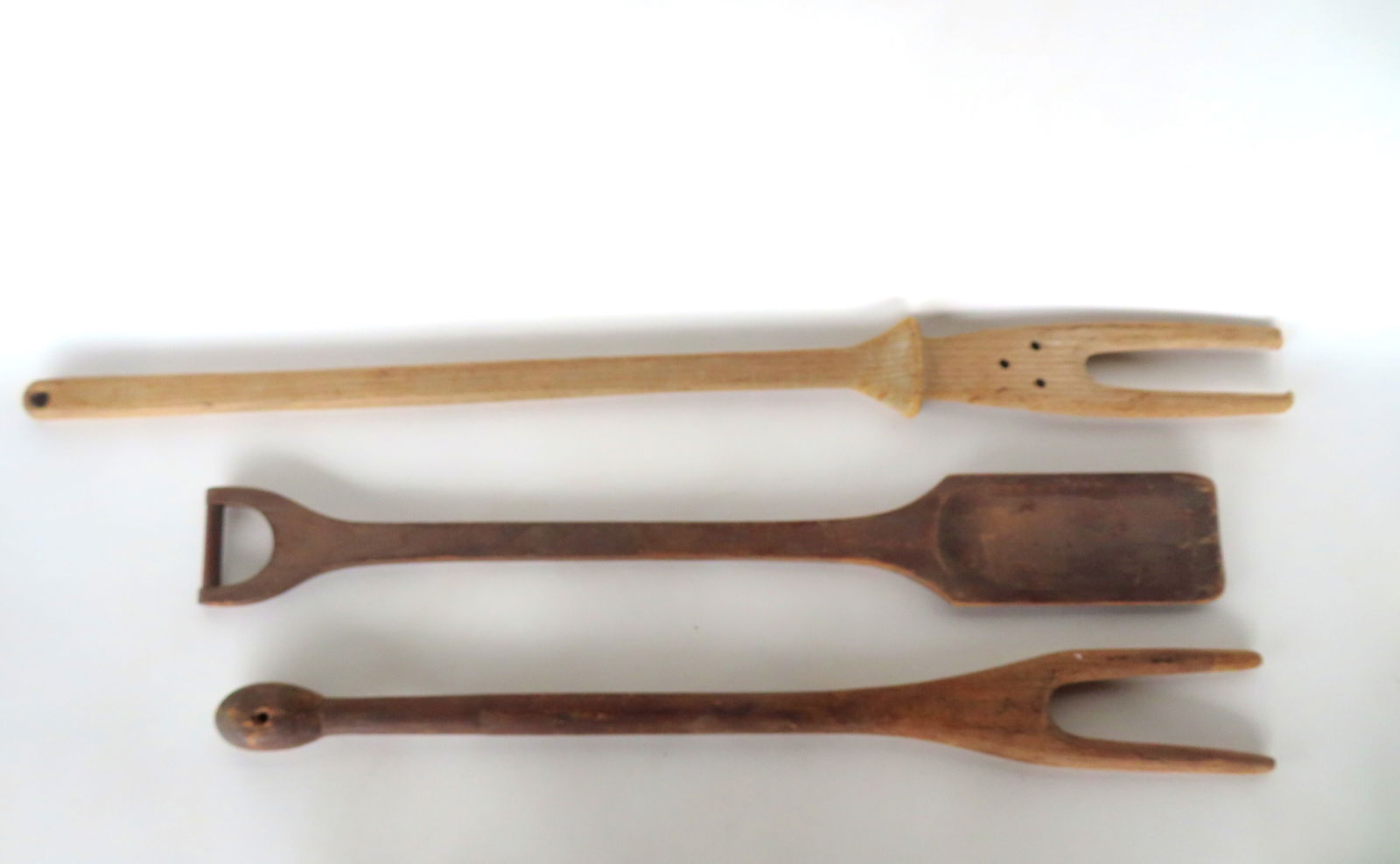 Three hand made primitive wooden wash sticks, 19th century, all in good condition. The largest 34: Three hand made primitive wooden wash sticks, 19th century, all in good condition. The largest 34 3/4"L. Provenance: From the Marni Bakst and William Sadler collection of antiques, Verbank NY.