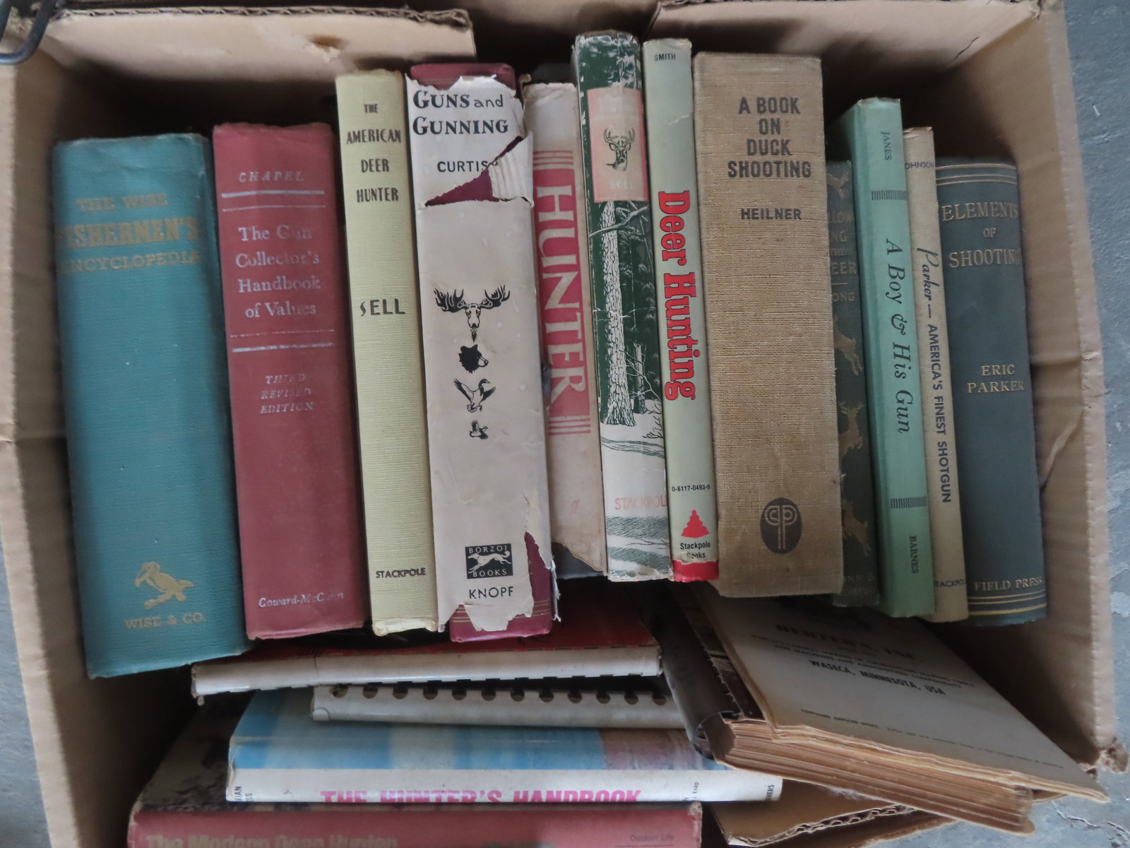 Large grouping of sporting books, most related to hunting including: Elements of Shooting 1924, Park: Large grouping of sporting books, most related to hunting including: Elements of Shooting 1924, Parker America's Finest Shotgun 1961, A Boy And His Gun 1951, Fly Fishing 1958, many books related to de