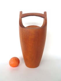 A Mid-Century modern Dansk teakwood ice bucket, staved construction, overhead handle with lid, and m