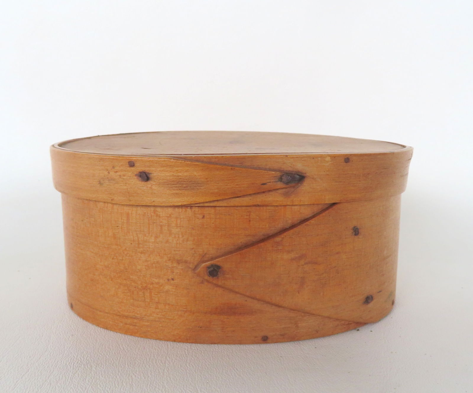 A single fingered oval box in very clean natural finish, circa mid 19th century. Measures 6 1/4"W x (1 of 5)