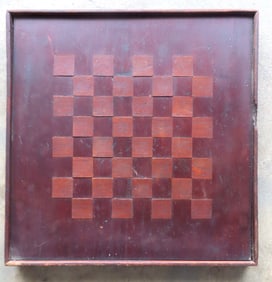 A hand made 19th century wooden checkerboard with inlaid squares. Original finish and original frame
