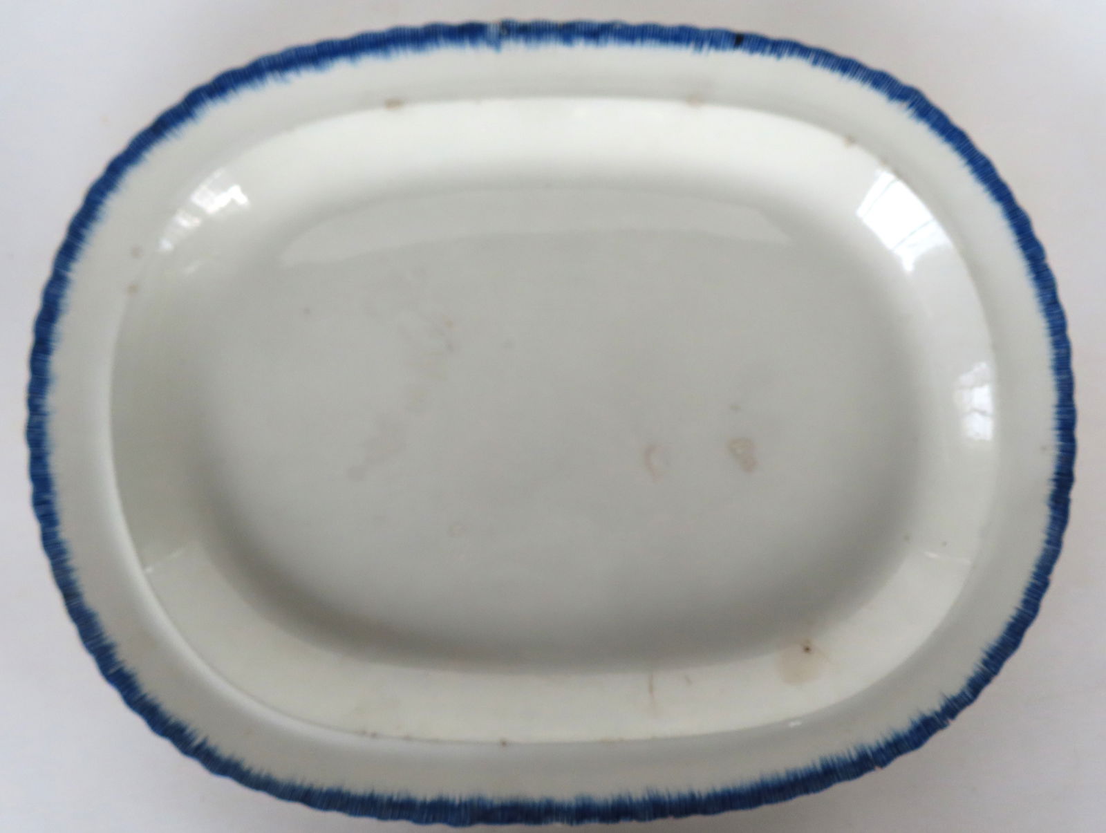 A Leed's platter with blue feather edge, mid 19th century. Some use wear and small chip on underside (1 of 5)