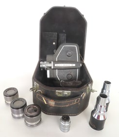 A Bell & Howell Model 240 16MM movie camera in original case and sold with 6 other lense