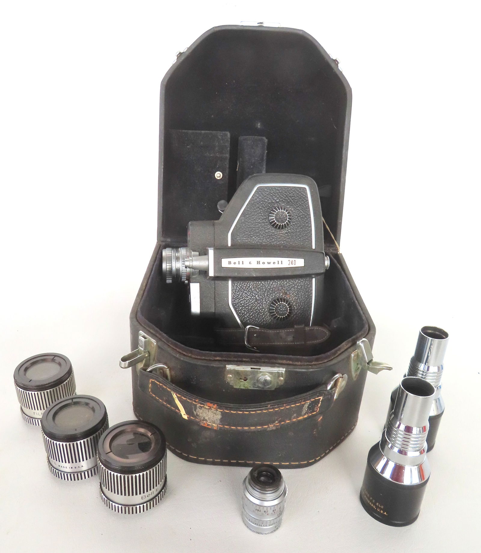A Bell & Howell Model 240 16MM movie camera in original case and sold with 6 other lense (1 of 10)