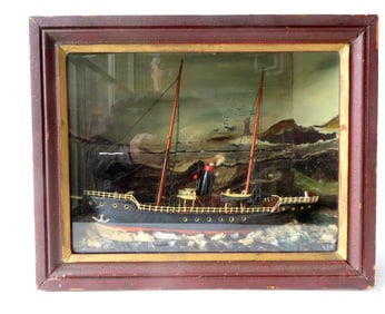 A sailing ship diorama housed in its original shadow box frame with hand painted molded waves and ha