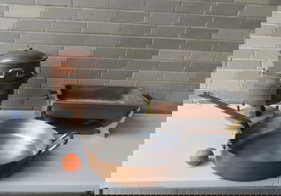 A grouping of commercial copper cooking pots and food heaters including: Frying pan with iron handle