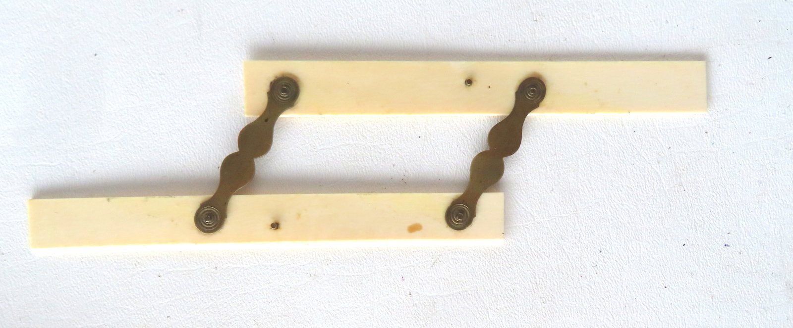 A nautical parallel rule, 19th century. Sold under NYS DEC permit which is not transferable.: A nautical bone parallel rule, 19th century. Sold under NYS DEC permit which is not transferable. Measures 6"L in closed position. Very good condition.