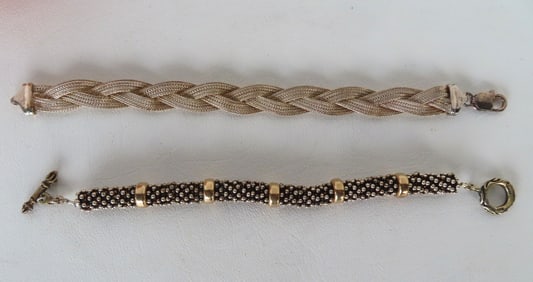 Two sterling silver lady's bracelets. The beaded bracelet with gold wash rings and marked "Mexico .9