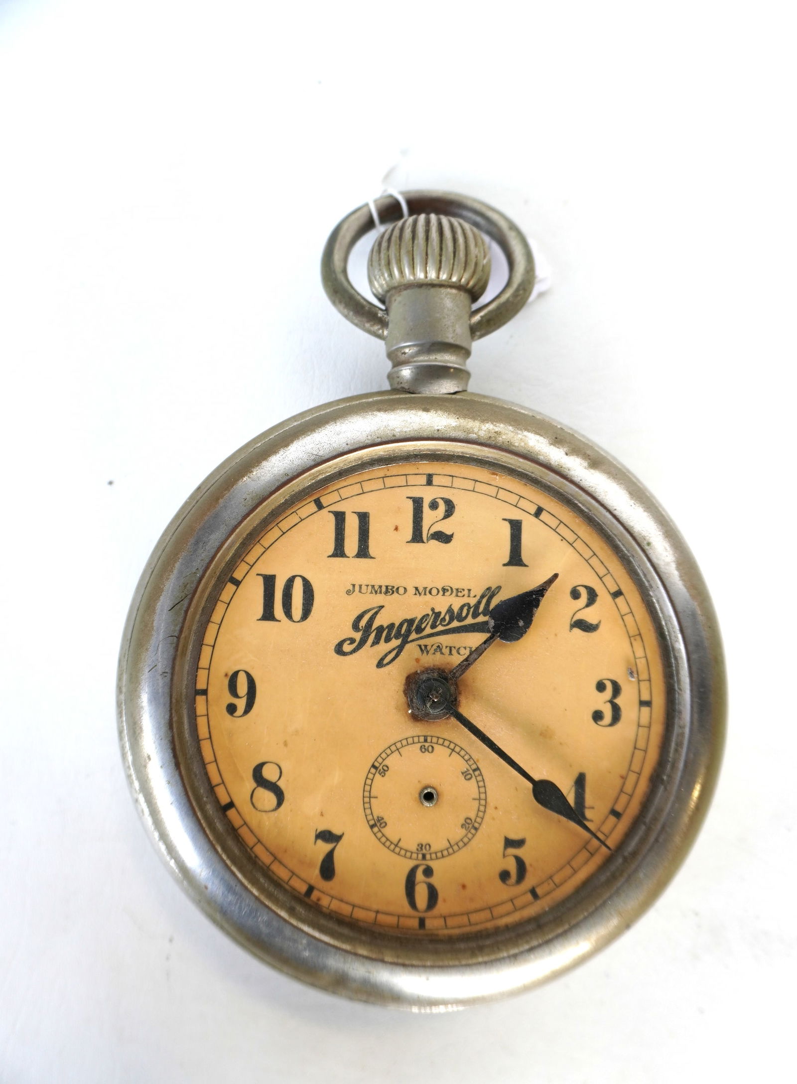 An Ingersoll adverising tin pocket watch with original windup mechanism, signed "INGERSOLL WATCH / J (1 of 5)