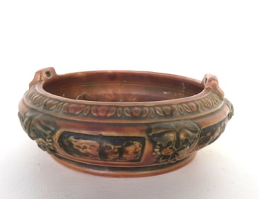 An art pottery hanging planter in matte green, good condition, no damage. Circa 1920.