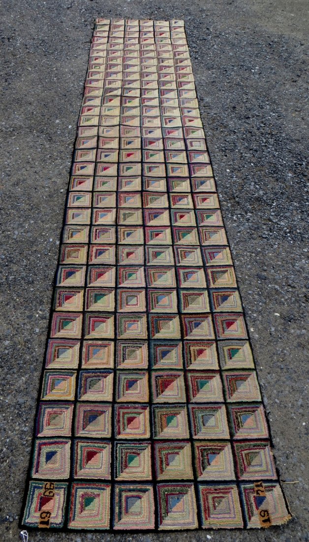 Hooked rug runner in log cabin pattern dated 1966 - 197: Hooked rug runner in log cabin pattern dated 1966 - 1971 in corners - one end with minor fringe damage otherwise very good condition. 12' 10" x 2' 6".