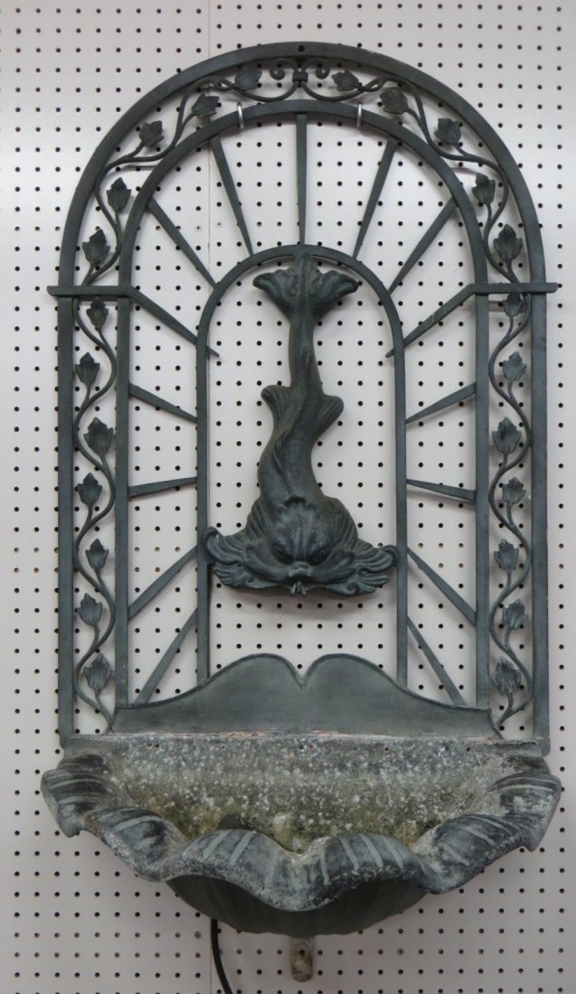 Wall mounted cast metal water fountain with water pump : Wall mounted cast metal water fountain with water pump - dolphin form figure on wall mounted back splash over shell shaped water basin holding pump. 46"H x 24"W.