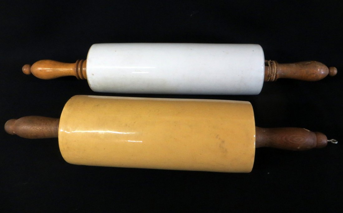 Two early rolling pins including yellowware - 14.5"L an: Two early rolling pins including yellowware - 14.5"L and white ironstone - 18.5"L. Both ceramics excellent condition, one handle with small piece chipped .