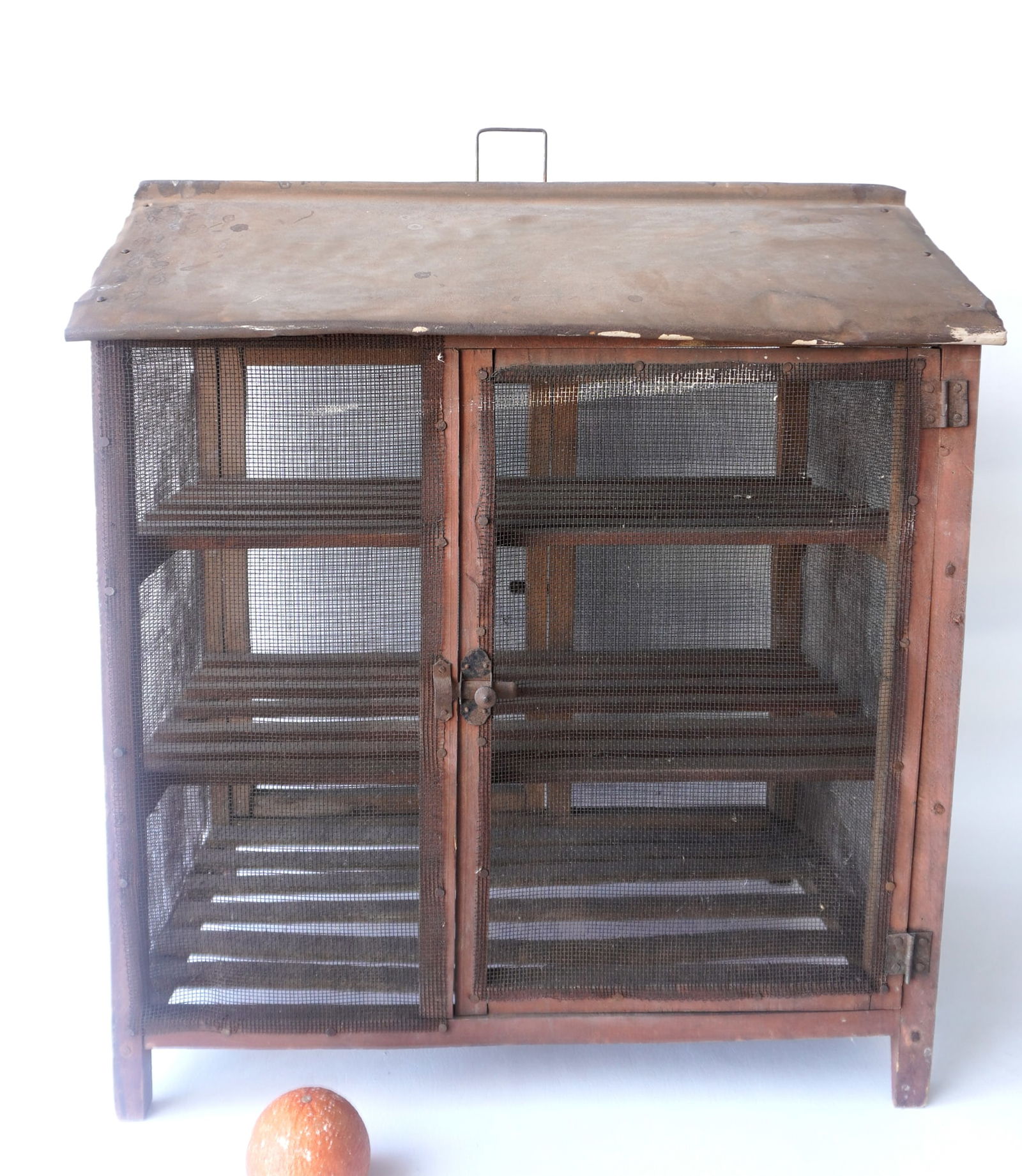 A primitive country store portable pie safe having a single door, screens on sides, 3 interior (1 of 6)