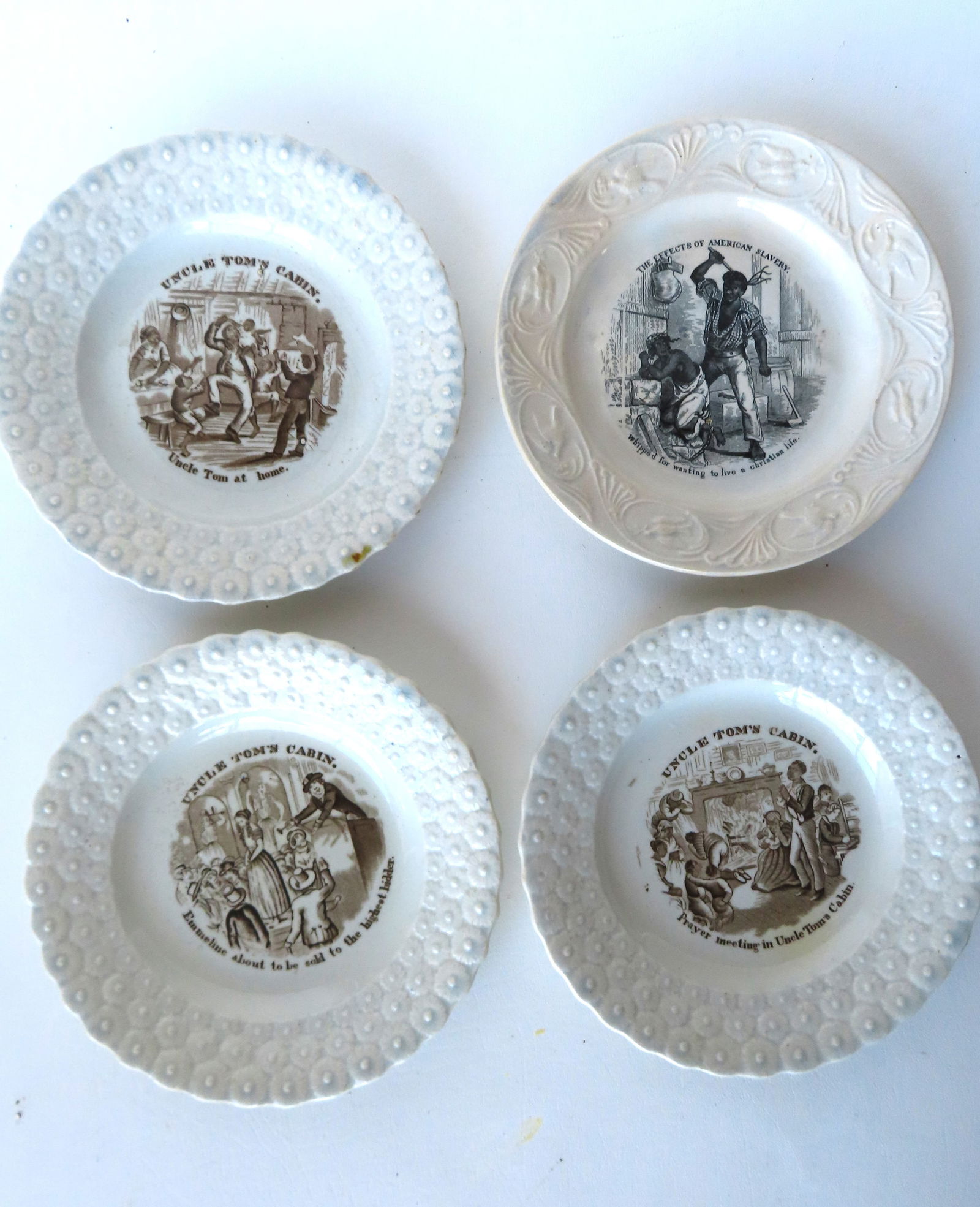 Four slavery related Staffordshire plates. Includes 3 matching Staffordshire plates from the "Uncle: Four slavery related Staffordshire plates. Includes 3 matching Staffordshire plates from the "Uncle Tom's Cabin" series, likely produced from the illustrations from the book of the same name by H.B. S