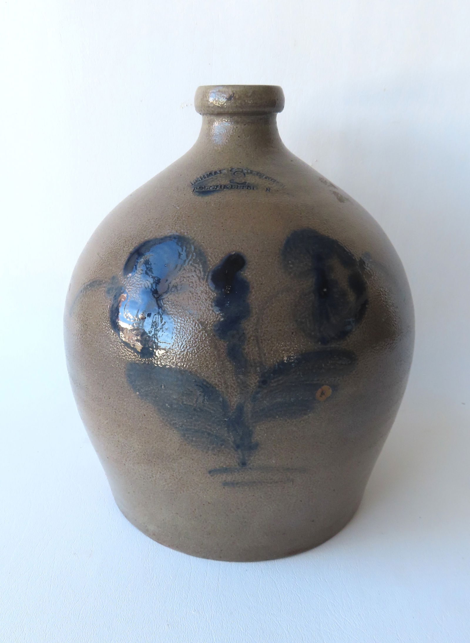 A stoneware jug, marked "LEHMAN & RIEDINGER / POUGHKEEPSIE NY", 2 gallon, decorated with a cobalt (1 of 6)
