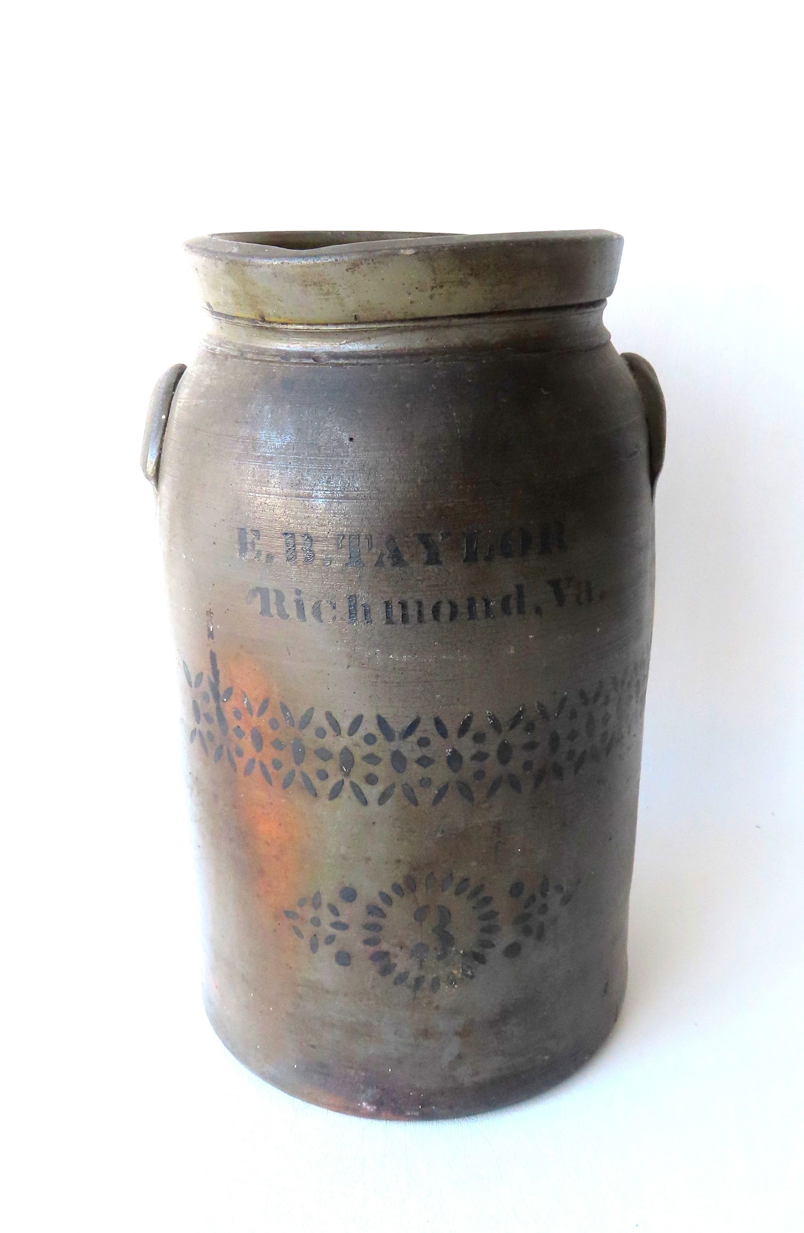 A southern 3 gallon pantry jar decorated with cobalt blue stenciling marked "E.B. Taylor / Richmond: A southern 3 gallon pantry jar decorated with cobalt blue stenciling marked "E.B. Taylor / Richmond Va." above stylized stenciled flowers. Measures 15"H x 9 1/2"W. There is a very tight hairline exten