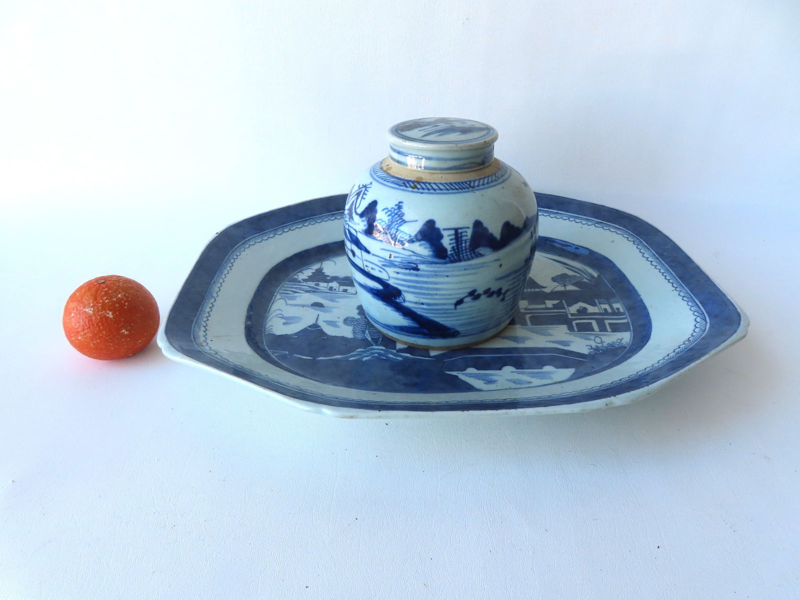 A large early Canton platter and a Canton ginger jar. The platter measures 18 5/8"W x 15 1/4"D x 2"H: A large early Canton platter and a Canton ginger jar. The platter measures 18 5/8"W x 15 1/4"D x 2"H and is in very good condition without damage or repairs; the ginger jar measures 6 1/2"H x 6"W and