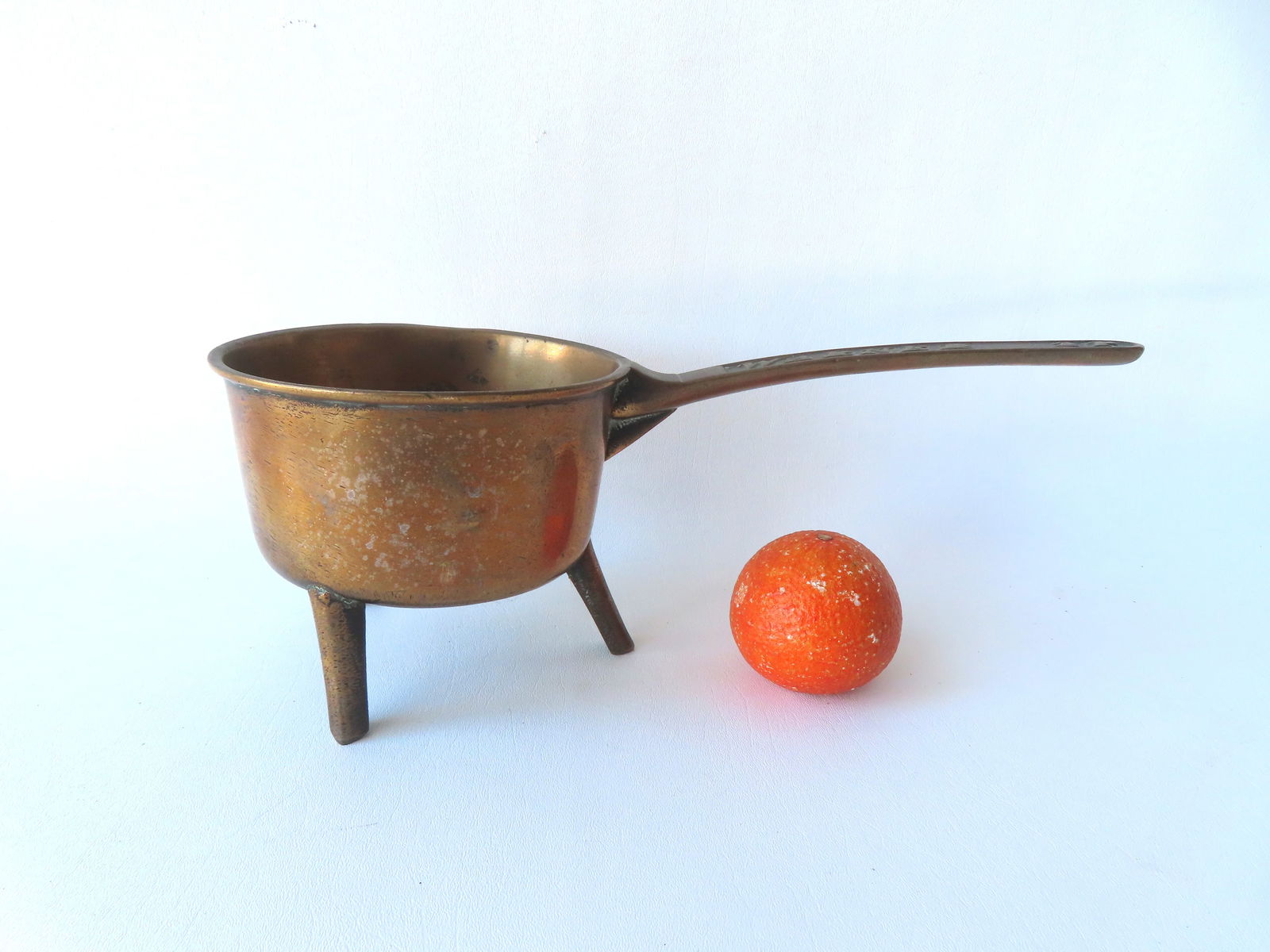 A bronze ponset signed on handle "Warner 3P" (3 pints) by the Warner Foundry, established in London: A bronze ponset signed on handle "Warner 3P" (3 pints) by the Warner Foundry, established in London in 1739 by John Warner, circa 1750. Typical use wear, and overall very good condition. Measures 15 1