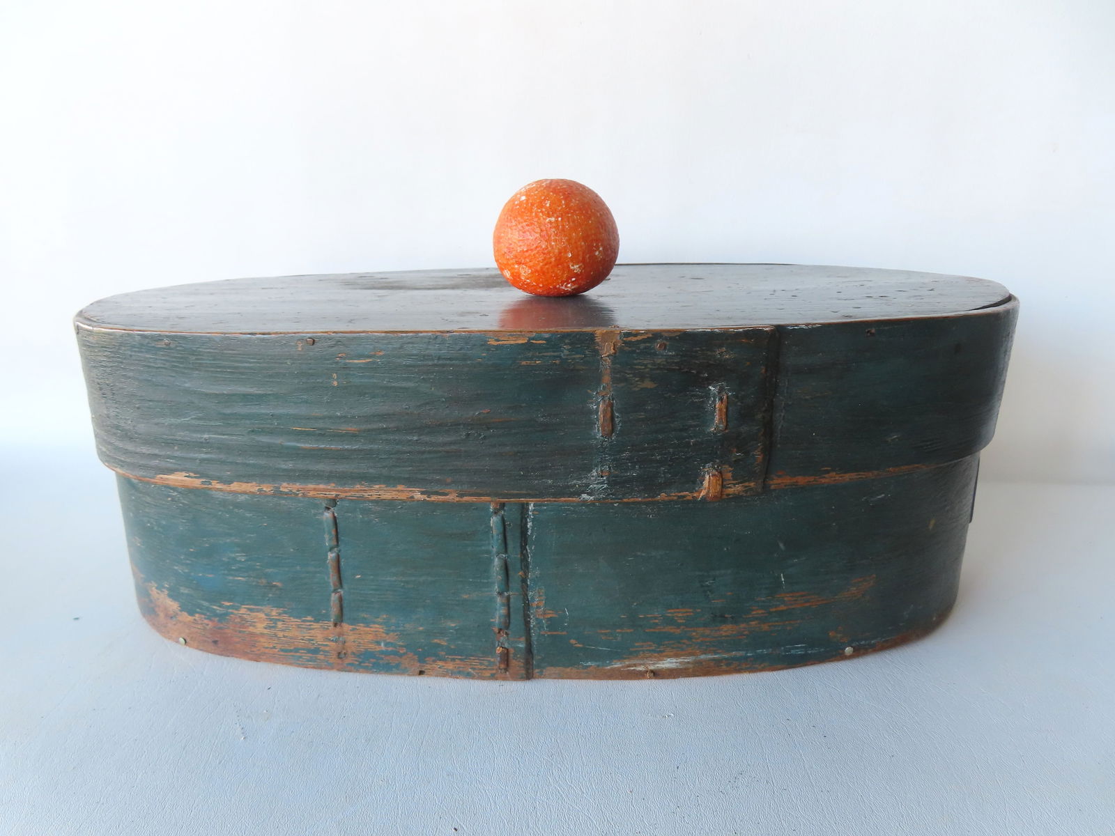 A large oval bentwood bride's box in original blue paint, remnants of original wall paper on (1 of 10)