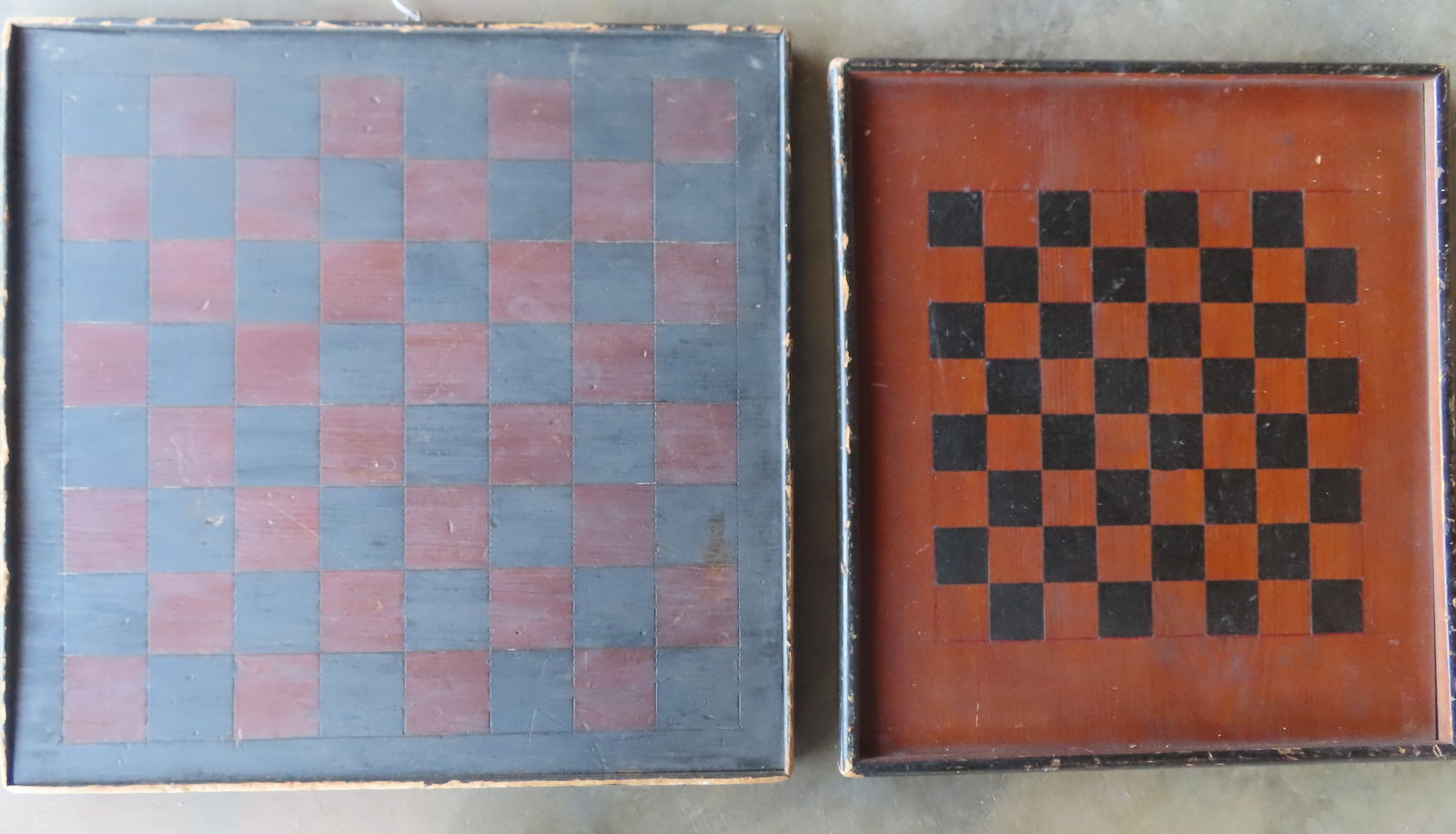 Two American game boards in old paint, 19th century - both with black painted squares and red: Two American game boards in old paint, 19th century - both with black painted squares and red stained squares with original molded borders - typical use wear to each and both in good overall condition