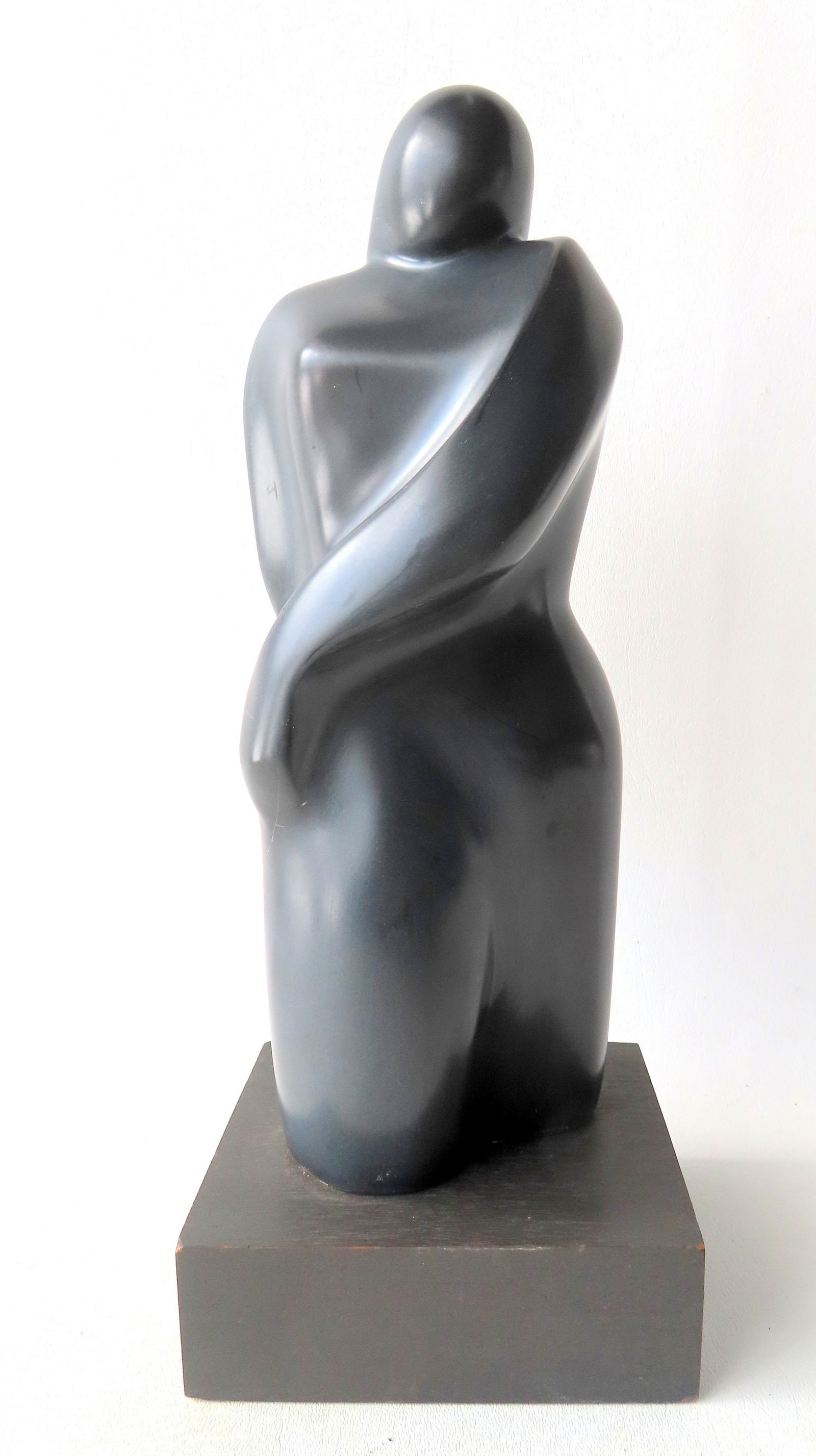Lilly M. Tussey - Bulgarian/American, d.2005. Modernistic dark gray stone sculpture, probably: Lilly M. Tussey - Bulgarian/American, d.2005. Modernistic dark gray stone sculpture, probably marble, depicting a woman with long hair, signed "L. Tussey '75", very good condition mounted on wooden ba
