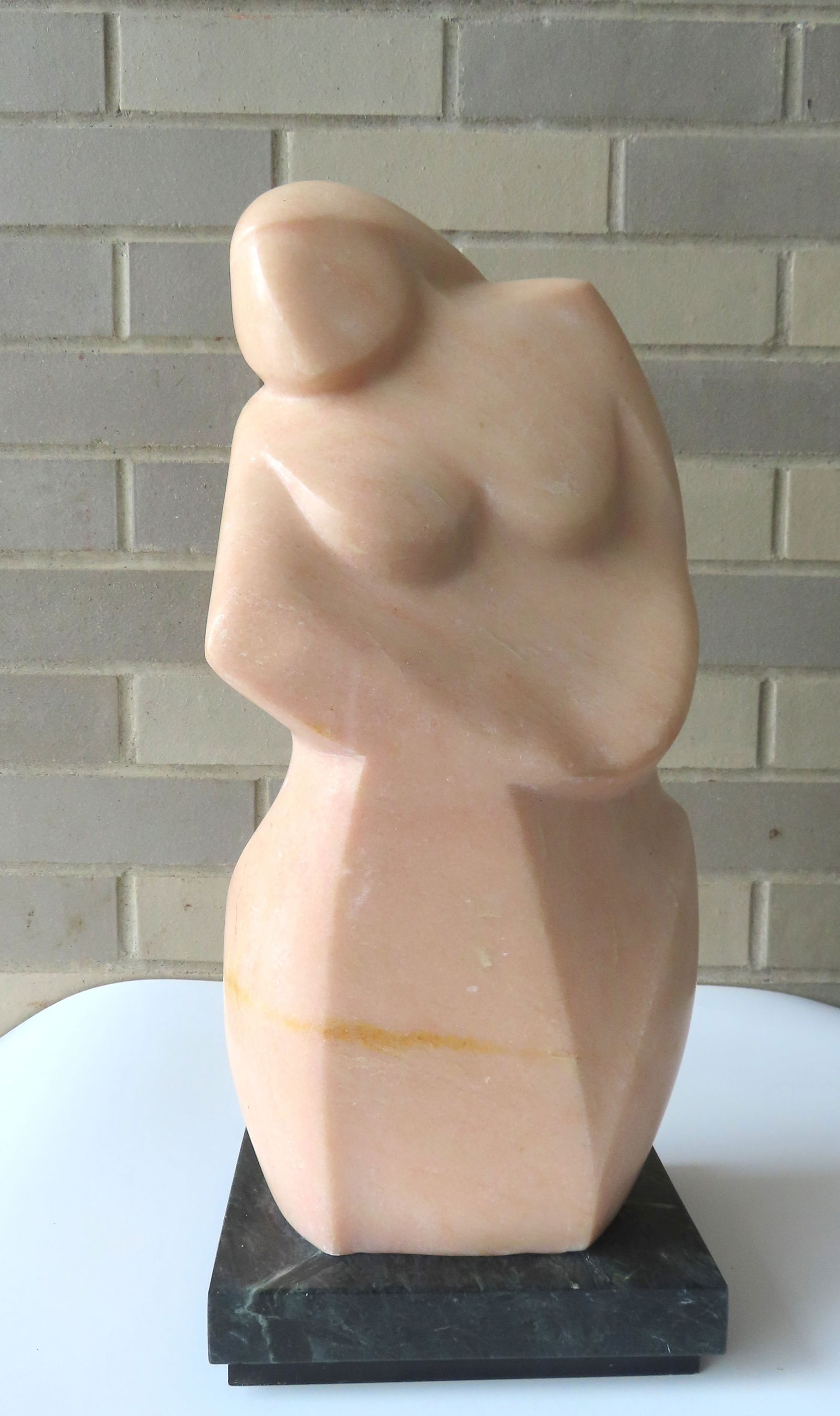 Lilly M. Tussey - Bulgarian/American, d.2005. Modernistic marble sculpture of a seated woman, circa: Lilly M. Tussey - Bulgarian/American, d.2005. Modernistic marble sculpture of a seated woman, circa 1970, signed "Lilly Tussey" - note paper label attached indicating the title "Seated Girl II". Very