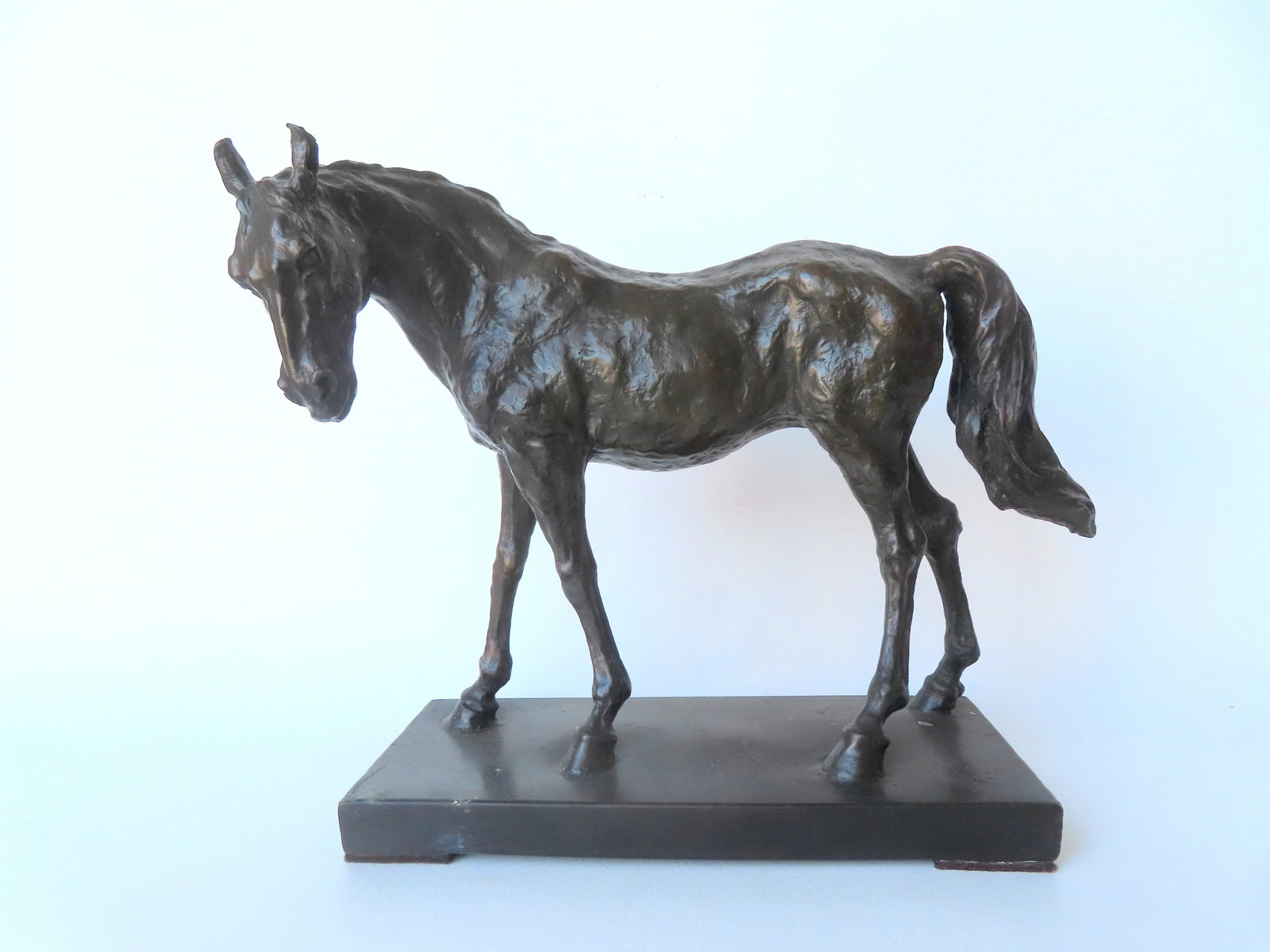 A bronze sculpture of standing stallion attached to a copper base signed Barye, probably after (1 of 8)