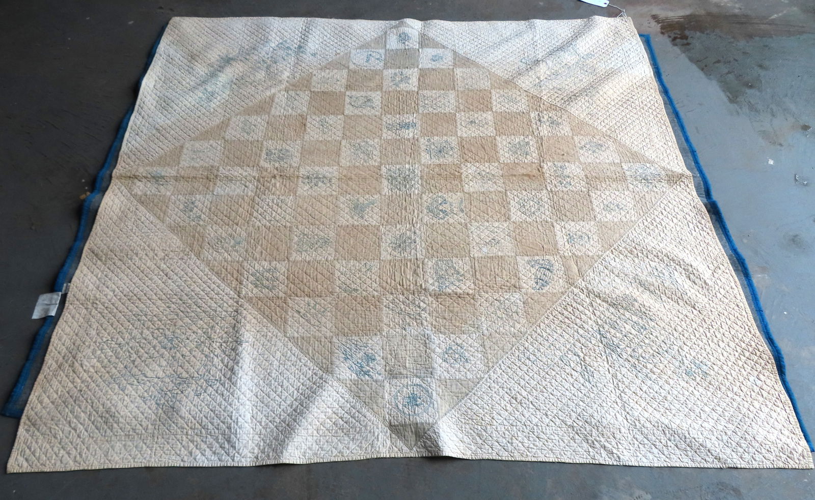 A very fine folk-art hand sewn and crocheted pictorial quilt, 19th century.: A very fine folk-art hand sewn and crocheted pictorial quilt, the entire front sewn with tight 1" quilted squares and also decorated with light blue crocheted squares throughout depicting various subj