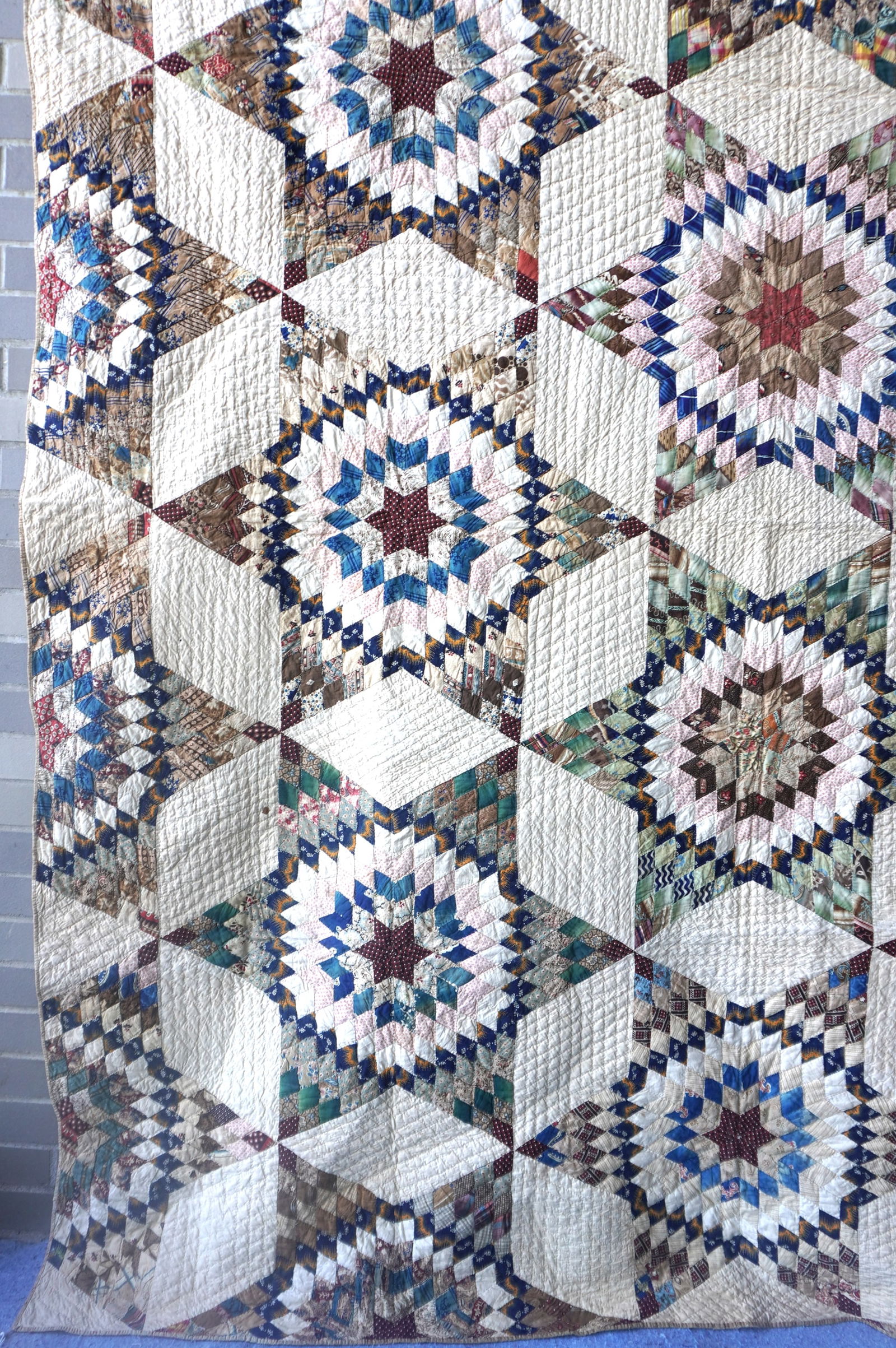 A very fine star pattern patchwork quilt - mid-19th century - 78" x 91" - several small points of - 6