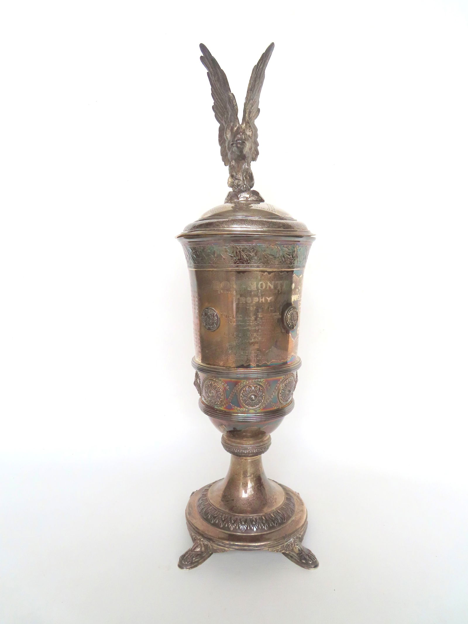 A Tiffany & Co. Sterling Silver, NY State Troop K, match shooting trophy with a domed lid having a: A Tiffany & Co. Sterling Silver, NY State Troop K, match shooting trophy with a domed lid having a large spread wing eagle finial, with tournament dates 1940-1941-1942-1943. Engraved across the front