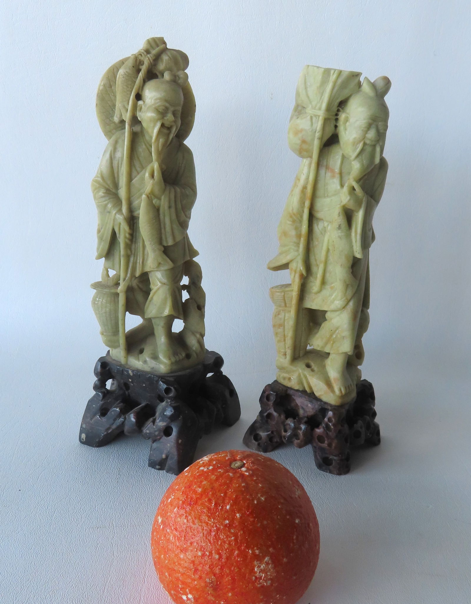 Two soapstone sculptures of oriental fishermen, both appear to be in very good condition. The: Two soapstone sculptures of oriental fishermen, both appear to be in very good condition. The largest measures 10 1/4"H. Provenance: From the Marni Bakst and William Sadler collection of antiques, Ver