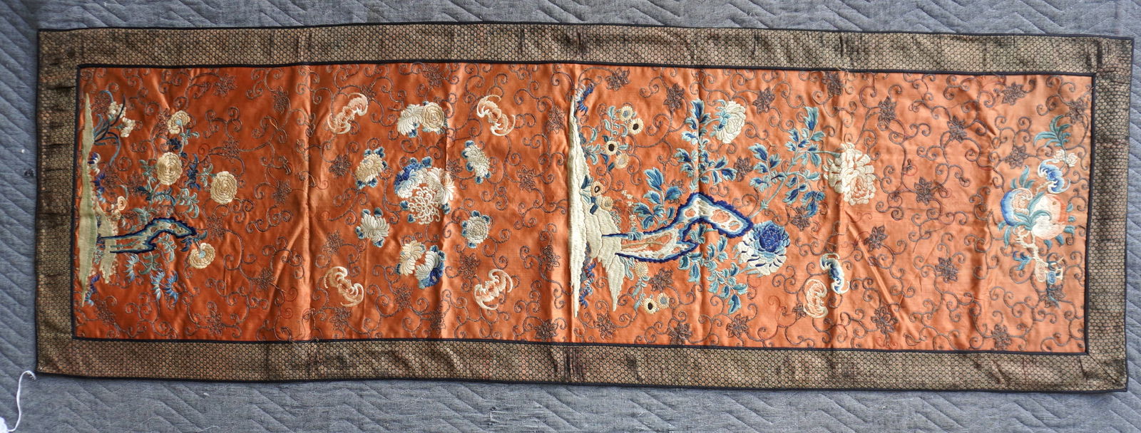 A Chinese silk table runner embroidery decorated with flowers, scrolls and bats - the silk border (1 of 9)