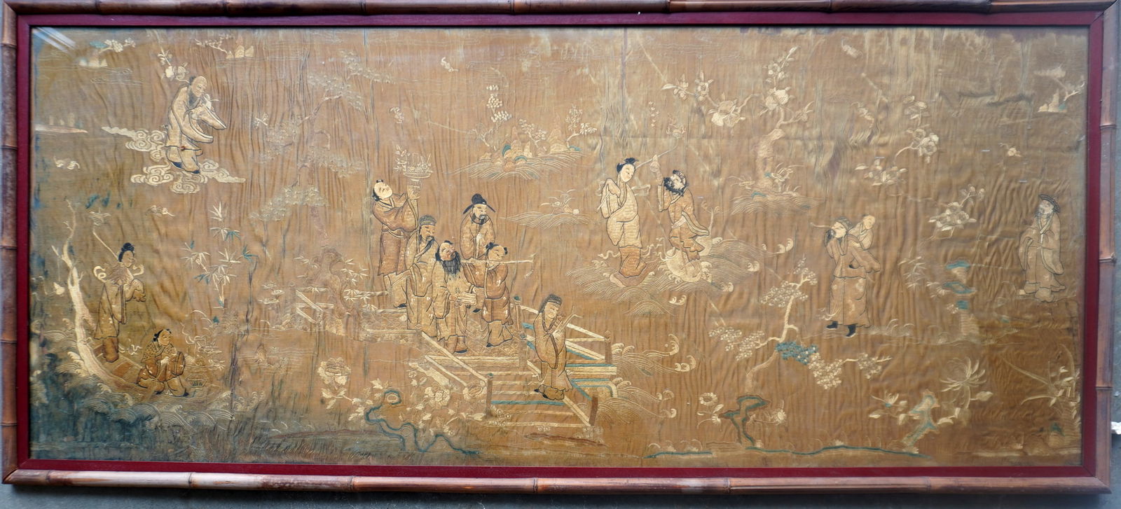 A Chinese silk tapestry decorated with oriental figures, flowers and trees, 18th century or earlier, (1 of 14)