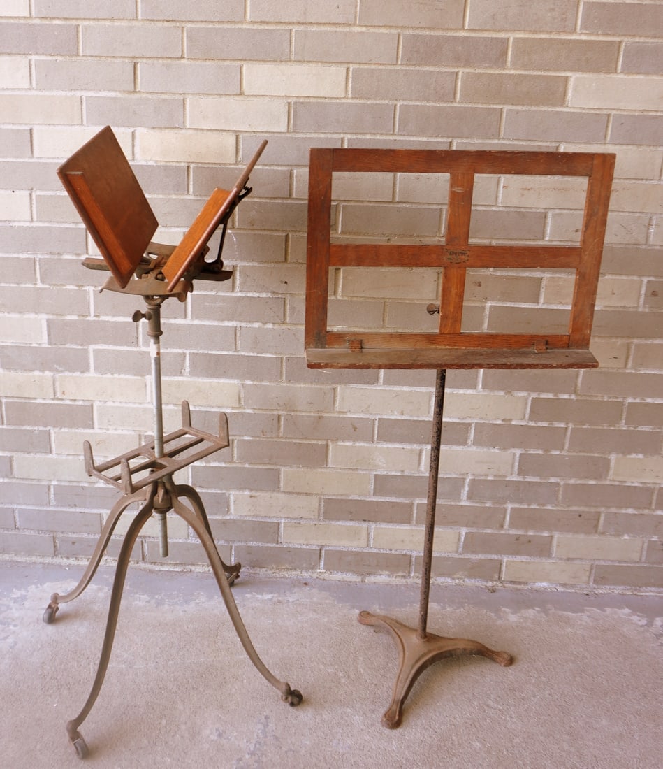 An oak adjustable book stand on iron base - 17" square at base x 42"H; and a oak music stand on: An oak adjustable book stand on iron base - 17" square at base x 42"H; and a oak music stand on adjustable iron base - 20"W x 41"H. Both need cleaning, else in good condition, late 19th century. The l