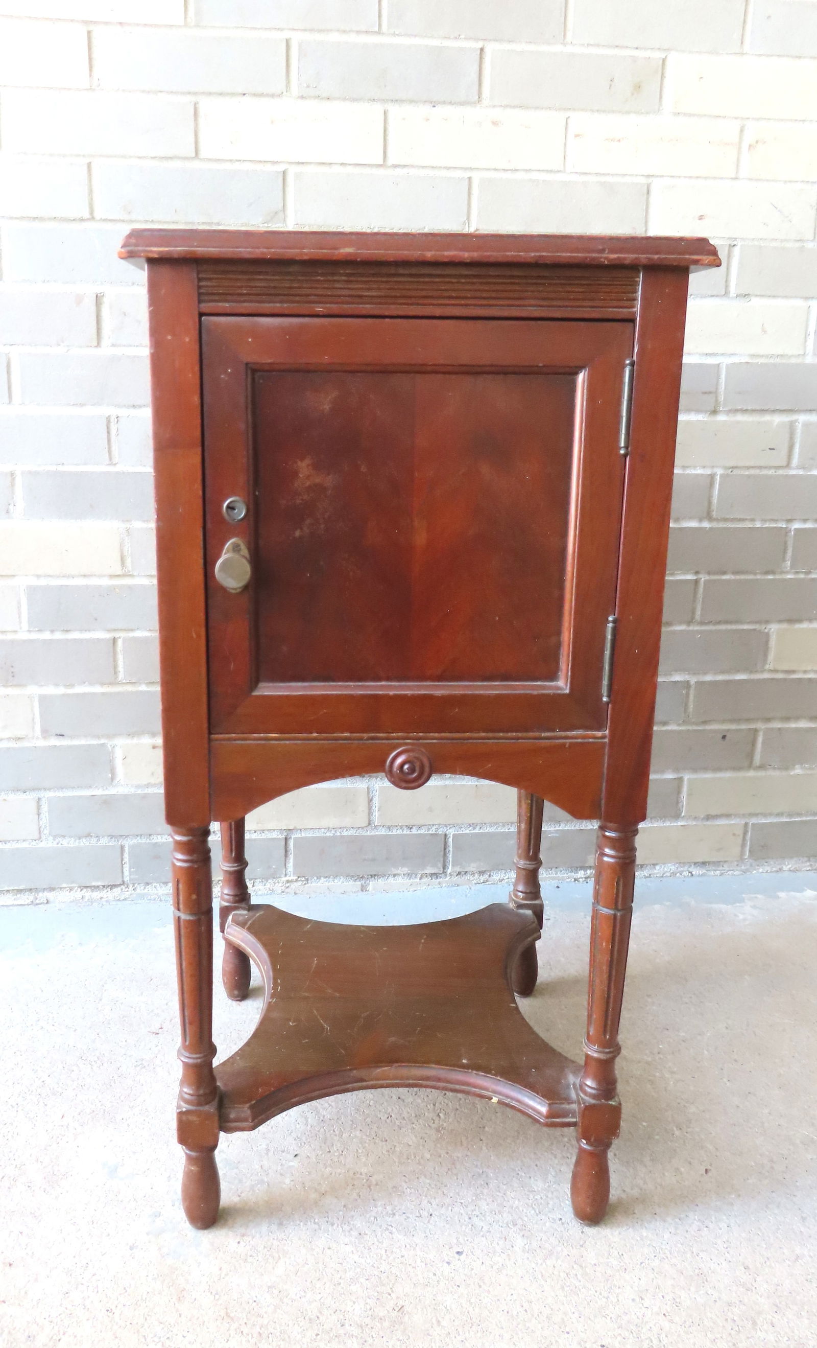 Night stand with built in safe, signed The "F.B.M. Co. Hoboken NJ" (Ferguson Brothers Manufacturing: Night stand with built in safe, signed The "F.B.M. Co. Hoboken NJ" (Ferguson Brothers Manufacturing Company). The stand is likely Poplar wood and stained a walnut color, has a single door that opens t