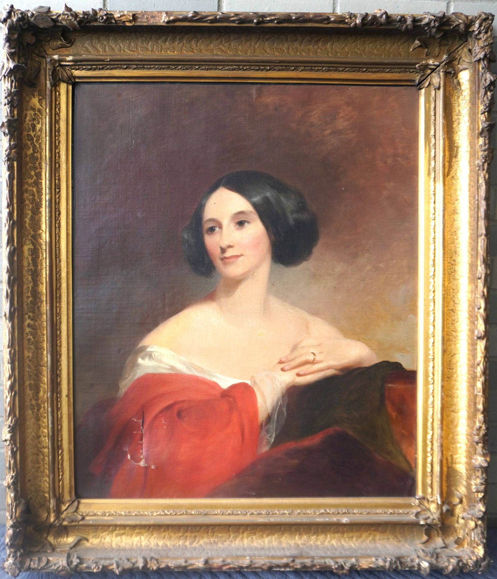 O/C Portrait of a stylish lady wearing a red cloak over a white dress, early to mid 19th century,: O/C Portrait of a stylish lady wearing a red cloak over a white dress, early to mid 19th century, housed in an ornate gilt gesso frame from the same period, in the school of Thomas Sully (American/Eng