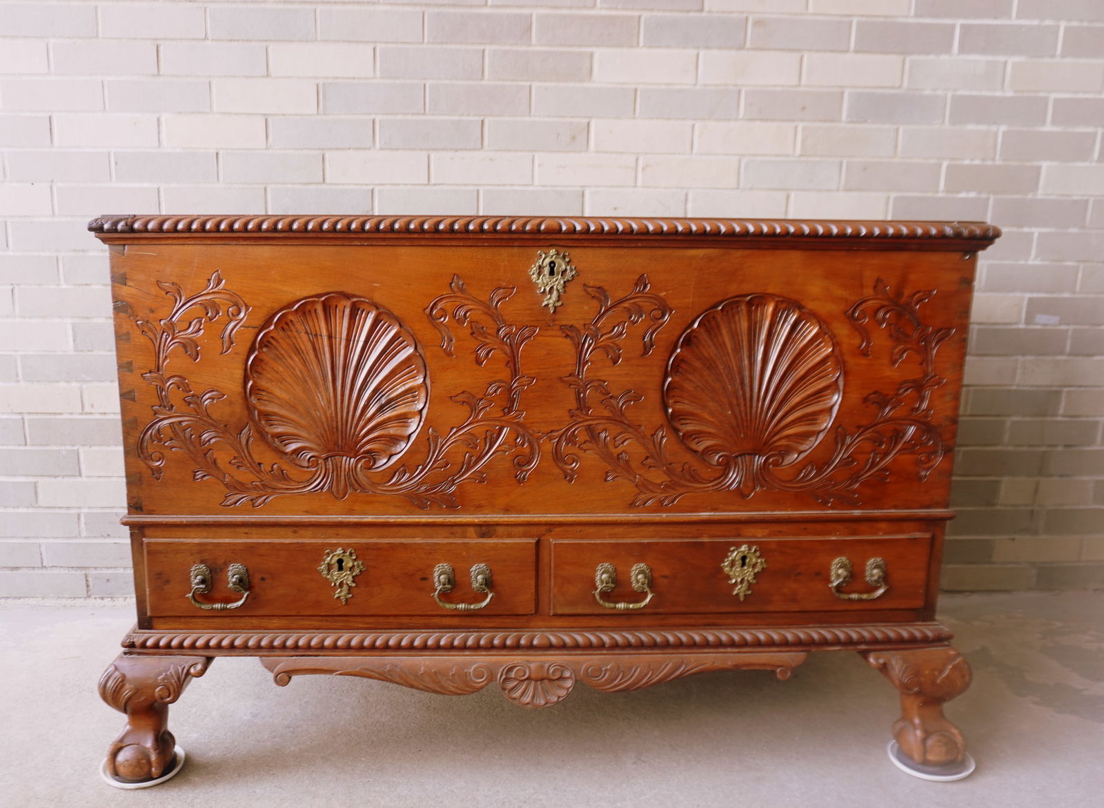 A Chippendale claw and ball foot dower chest believed to Pennsylvania origin in butternut. The lid (1 of 20)