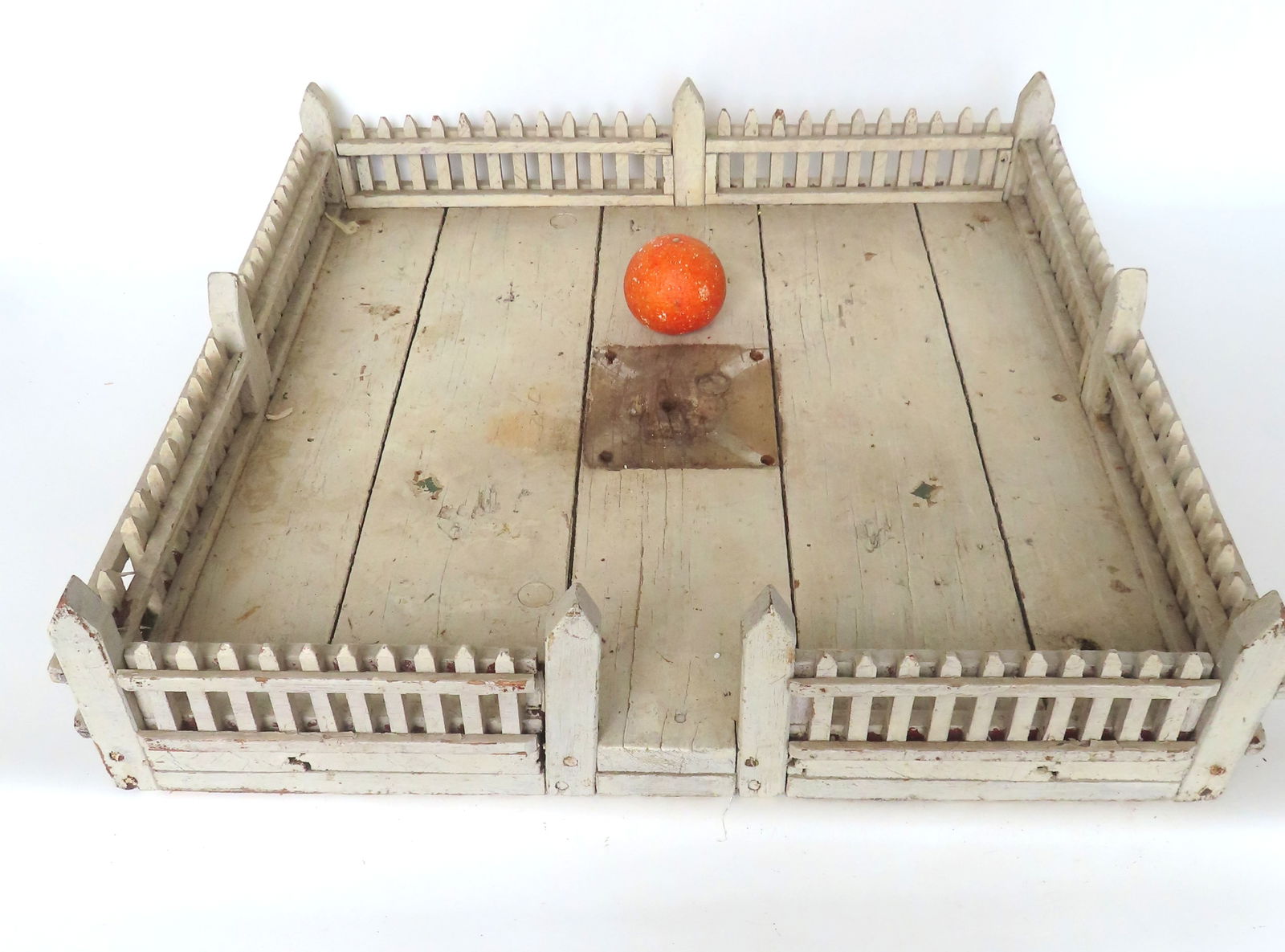 A vintage white picket fence surround for a small Christmas tree, early to mid 20th century. Some: A vintage white picket fence surround for a small Christmas tree, early to mid 20th century. Some use wear, missing one picket, missing tree holder that was attached to center, otherwise good conditio