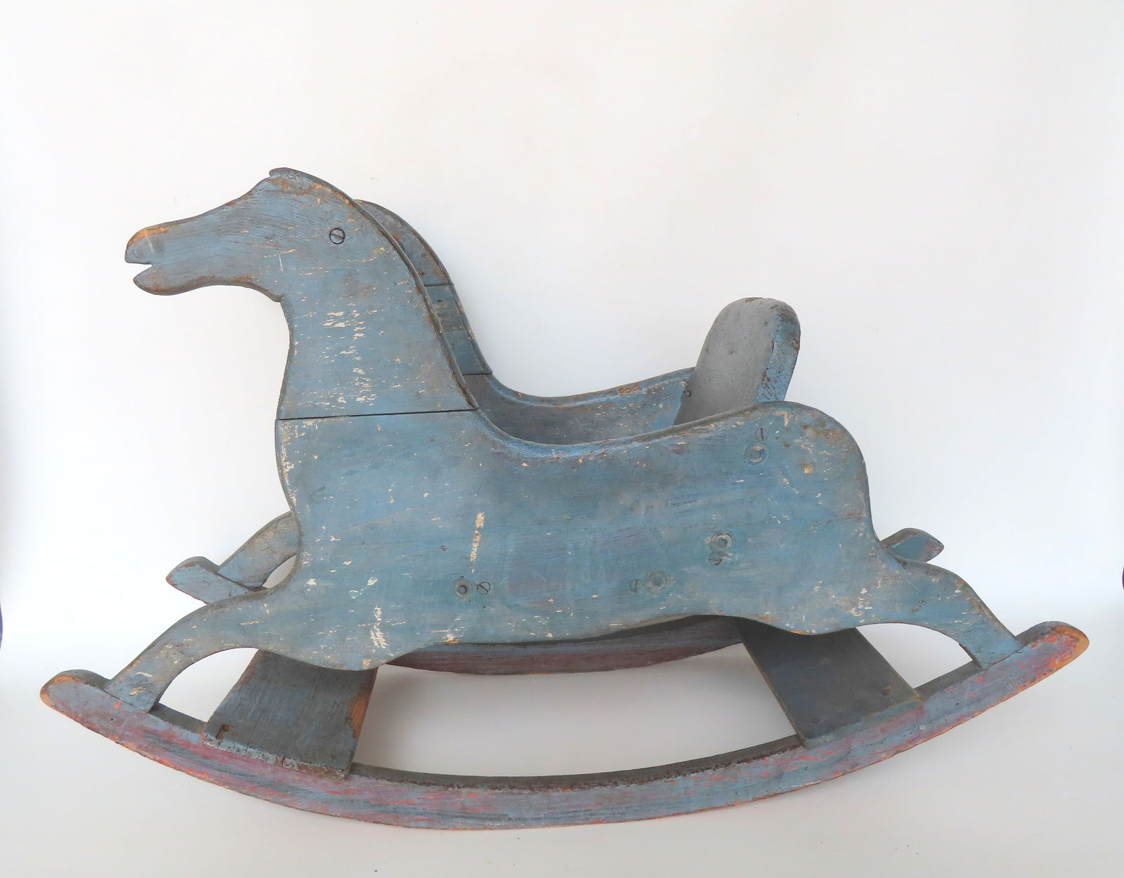 A double silhouette wooden rocking horse, in old, but not original, blue paint. Old glued repair to (1 of 4)