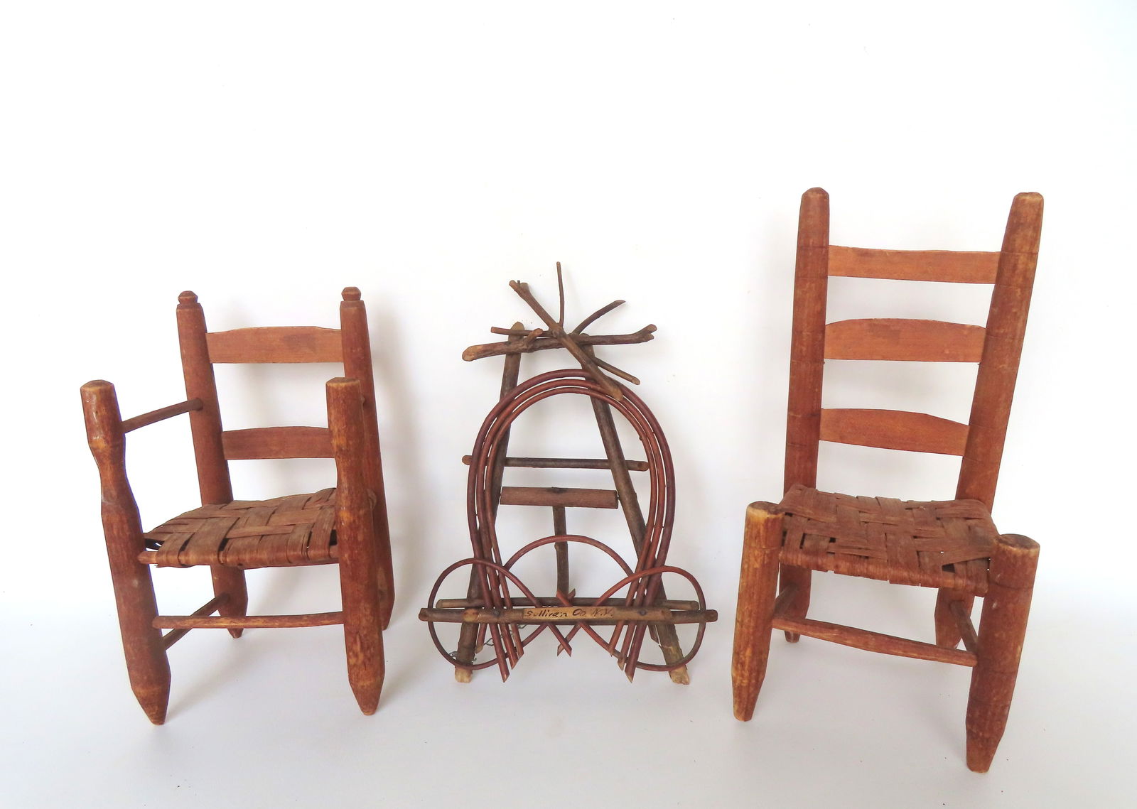 Three rustic miniatures including: A Catskill folk art twig table top easel in the form of a: Three rustic miniatures including: A Catskill folk art twig table top easel in the form of a horseshoe, signed "Sullivan Co. N.Y." - very good condition - 13 1/4"H x 8 3/4"W - early 20th century; and