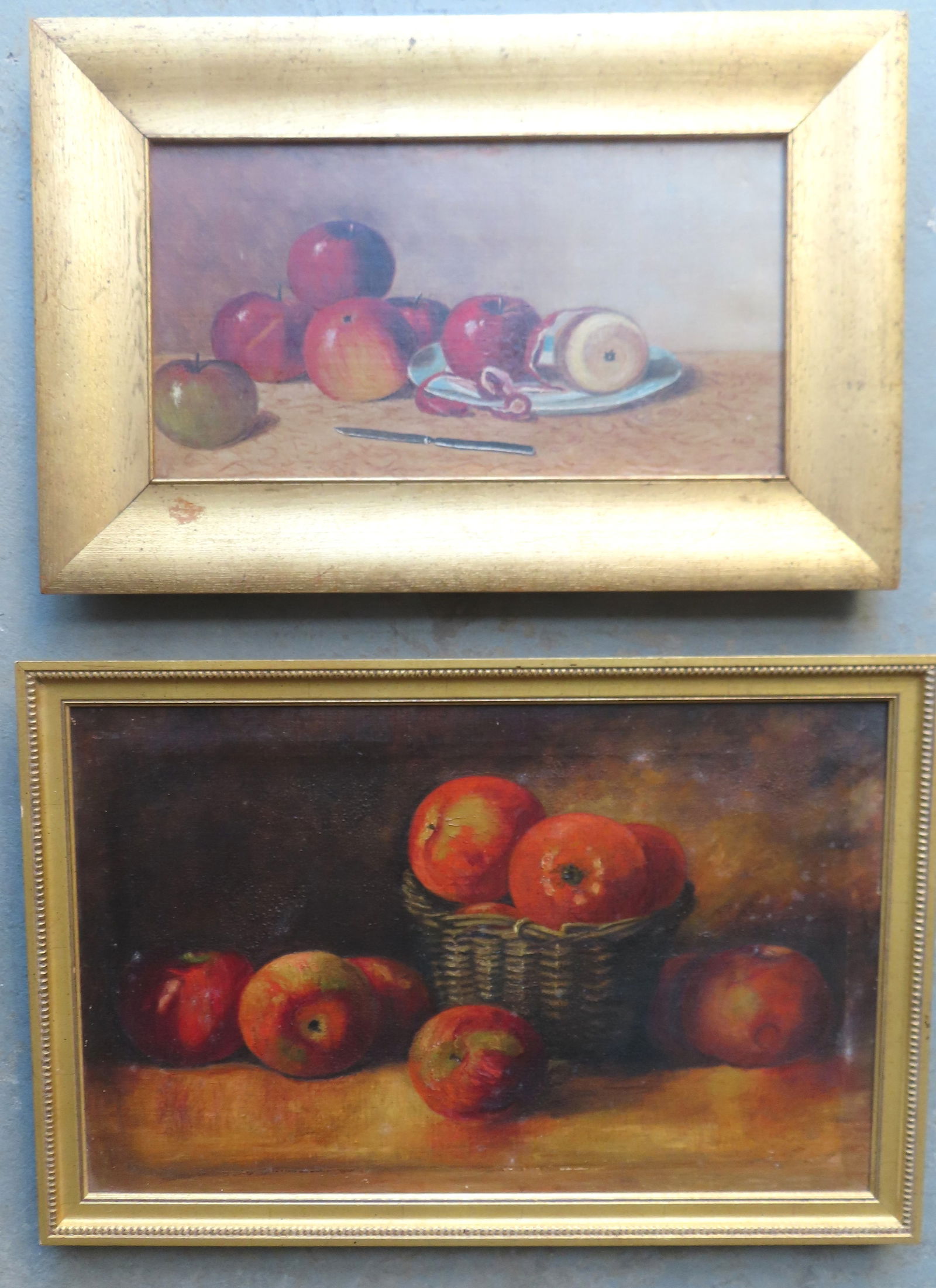 Two still life paintings, apples on table, late 19th century. The first in gilt oak frame and the: Two still life paintings, apples on table, late 19th century. The first in gilt oak frame and the stretcher with cast iron brackets in corners marked ADS and dated 1885 - apples on table, one apple pa