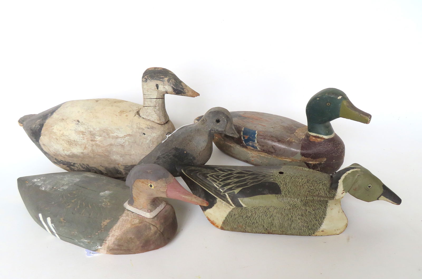 Five primitive decoys including: Merganser - small chip on underside of bill, probably old second (1 of 13)