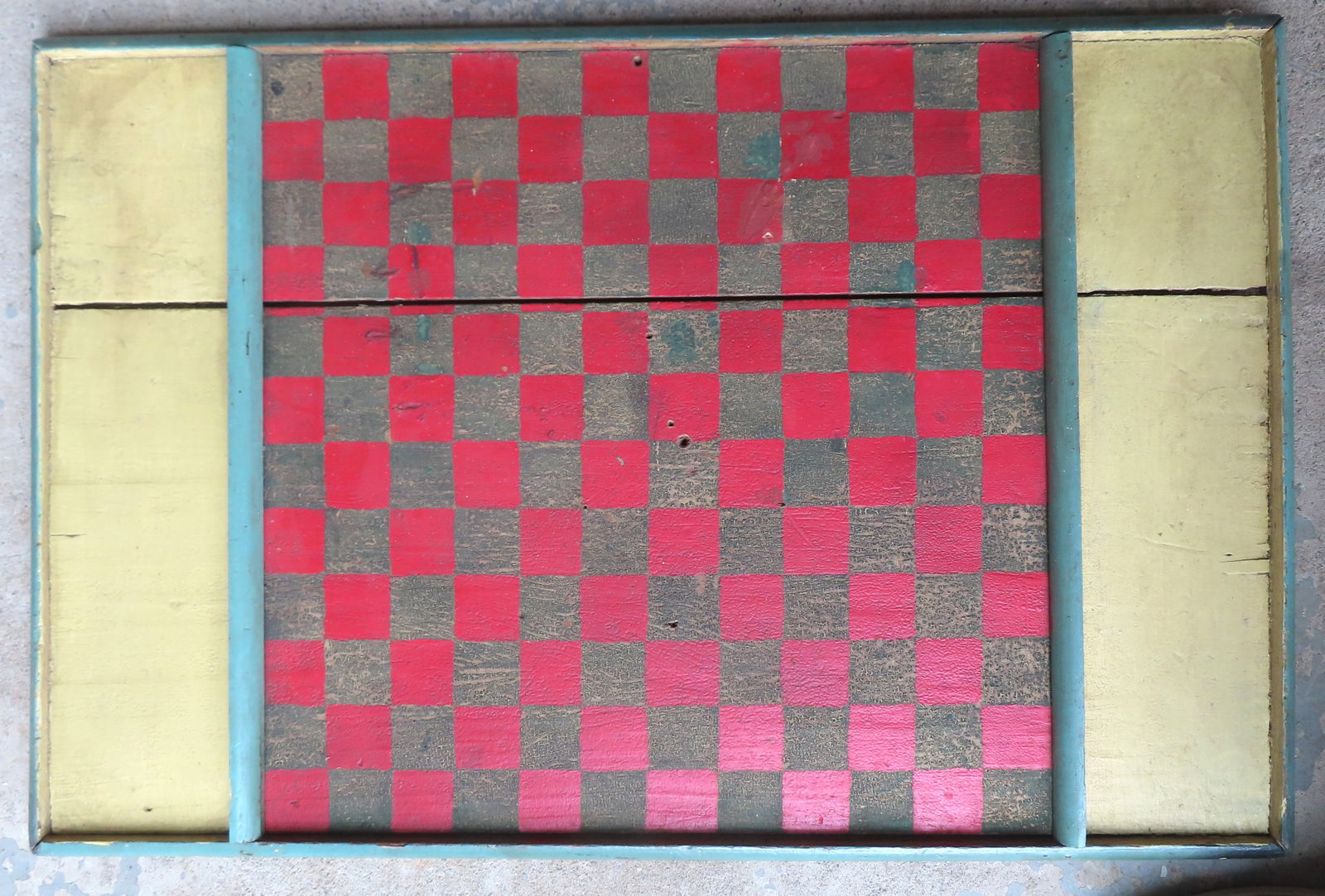 A large colorful game board in original red, green and yellow paint, having a molded border attached (1 of 5)