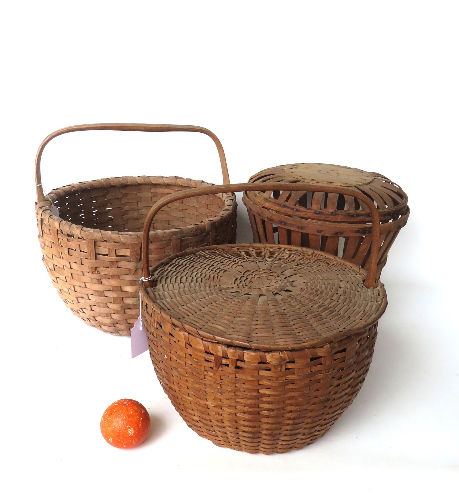 Three large country woven baskets including: Covered woven splint basket with carved wooden overhead (1 of 19)