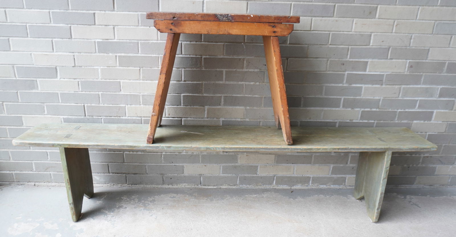 Two primitive benches with bootjack ends and see-through mortise construction, circa 1820-50. The: Two primitive benches with bootjack ends and see-through mortise construction, circa 1820-50. The smallest measures 24"L x 11"D x 22"H - the largest, with traces of original blue paint, measures 75 1/