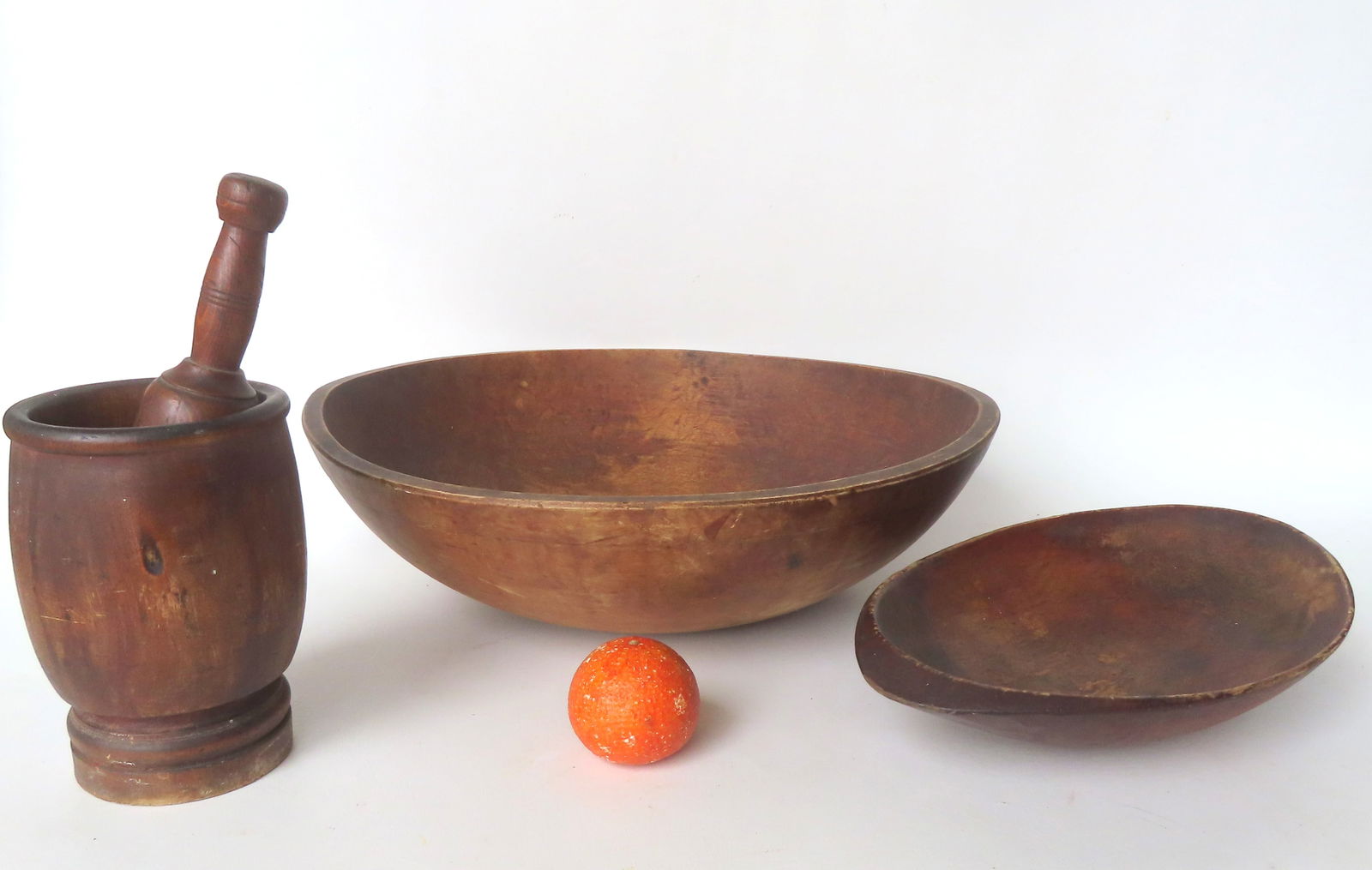 Three country kitchen collectibles, 19th century, including: a large treenware bowl with molded edge (1 of 12)