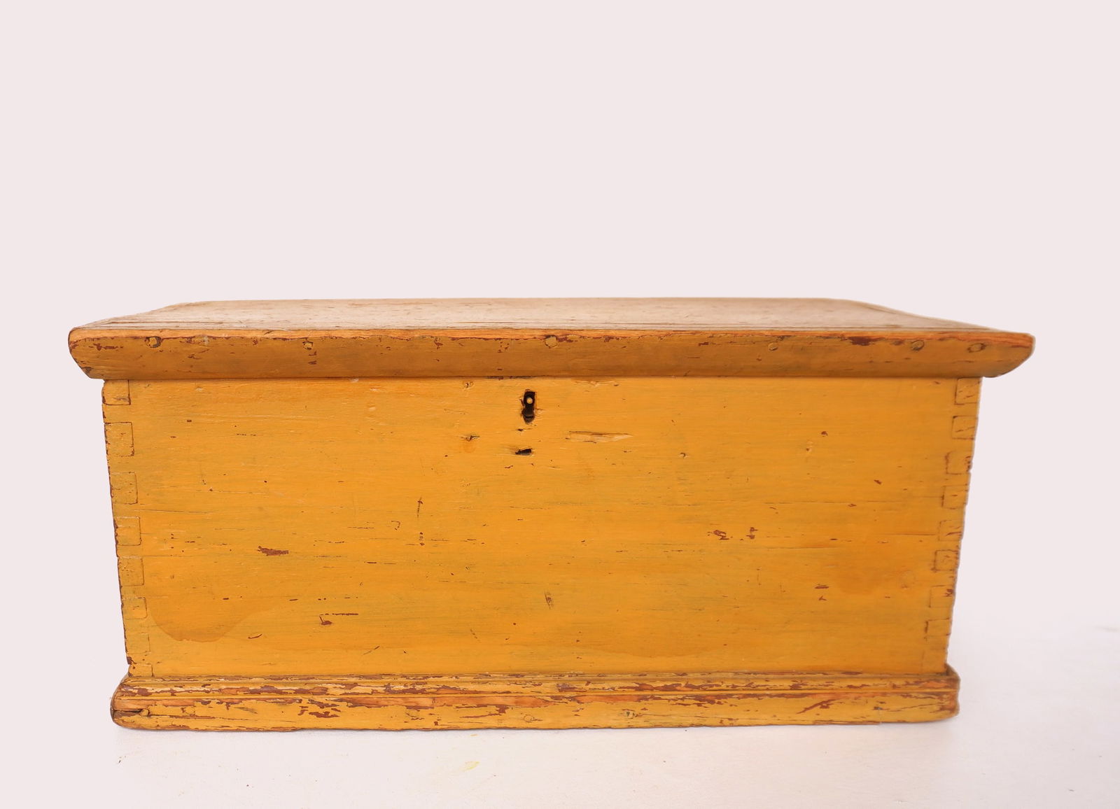A primitive storage box in a very old yellow paint over original red paint, dovetailed case, circa (1 of 7)