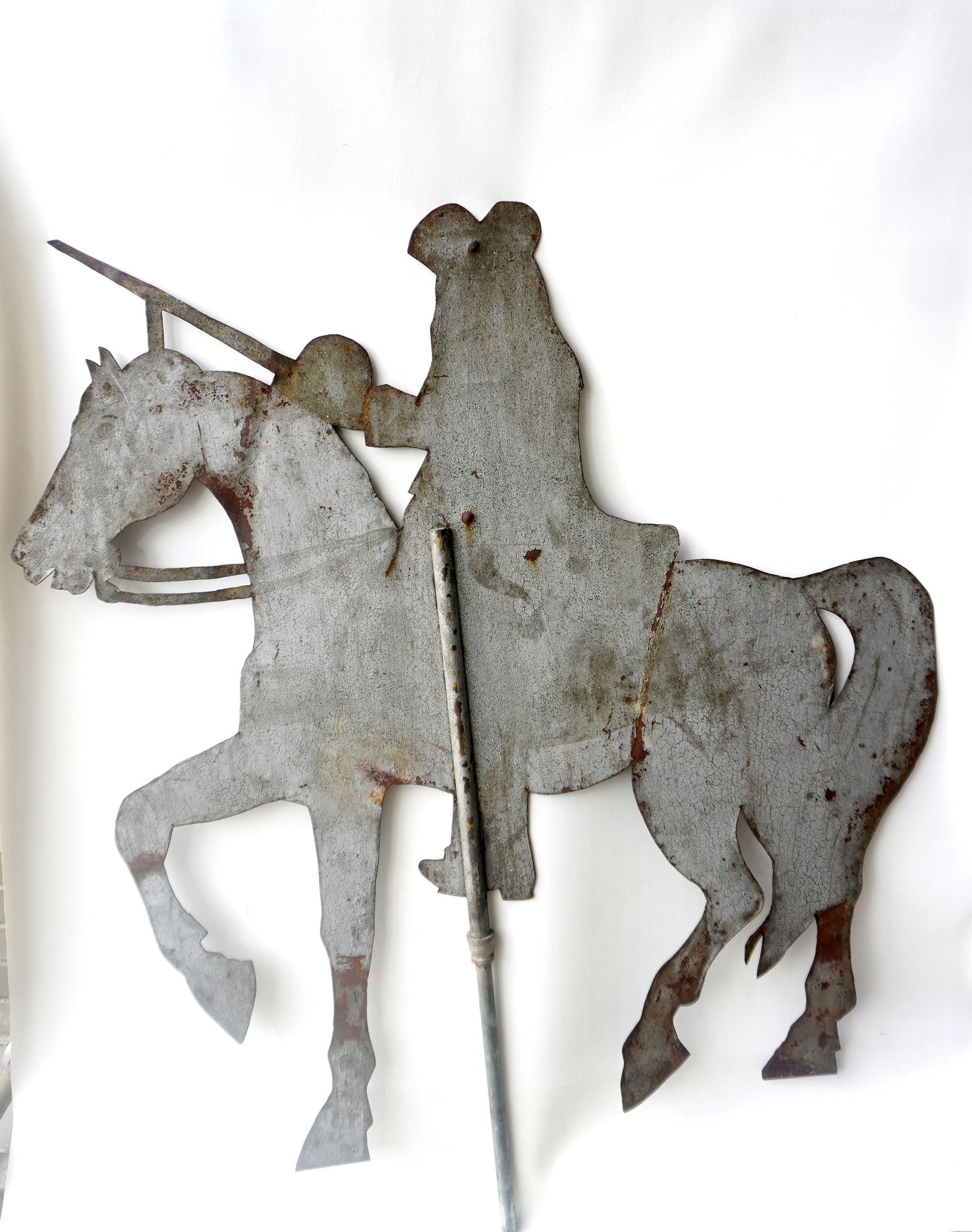 A large sheet metal weather vane depicting a military soldier on horseback probably George: A large sheet metal weather vane depicting a military soldier on horseback probably George Washington. Very good patinated surface and overall very good original condition, circa 1900. Measures 48 1/4